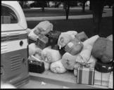 Hayward,_California._Baggage_of_evacuees_of_Japanese_ancestry_stacked_at_public_park_as_evacuation_._._._-_NARA_-_537500.jpg