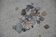 pebbles-beach-sand-sea-261314.jpg