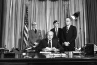 President_Ford_signs_emergency_appropriations_legislation_for_the_National_Swine_Flu_Immunization_Program_-_NARA_-_7064720.jpg