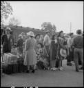 Woodland,_California._Families_of_Japanese_ancestry_with_their_baggage_at_the_railroad_station_wait_._._._-_NARA_-_537805.jpg