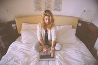 woman-working-bed-laptop-typing-731894.jpg