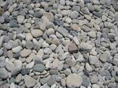 pebbles-beach-stones-nature-round-384934.jpg