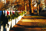 Suburban_Sidewalk_with_Red_Ribbons_on_Fence.jpg