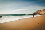 beach-sand-ocean-footprints-person-690125.jpg