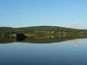 Mirror lake with green hill.jpg