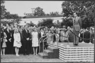 President_Nixon_speaks_to_assembled_White_House_staff_on_the_south_lawn_after_return_from_Midway_Island_conference..._-_NARA_-_194635.tif