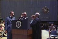 President_Nixon_watches_Judge_Clarence_Kelly_being_sworn-in_as_Director_of_the_Federal_Bureau_of_Investigation_(FBI)_-_NARA_-_194528.tif