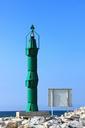 lighthouse-green-sea-blue-water-560736.jpg