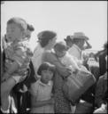 Turlock,_California._Evacuees_of_Japanese_ancestry_waiting_their_turn_for_baggage_inspection_for_co_._._._-_NARA_-_537657.jpg