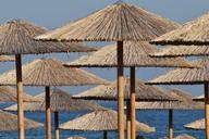 sun-umbrellas-reed-bamboo-beach-819944.jpg