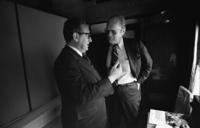 President_Ford_and_Secretary_of_State_Henry_Kissinger_confer_on_train_-_NARA_-_7161383.jpg