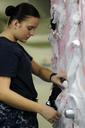 US_Navy_111030-N-XE109-457_Aviation_Electronics_Technician_Airman_Stephanie_L._Tschida_hangs_Halloween_decorations_aboard_the_aircraft_carrier_USS.jpg