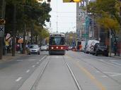 A streetcar passes classy but rundown buildings on Queen Street East, 2013 10 21 (7).jpg