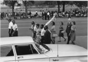 Civil_Rights_March_on_Washington,_D.C._(Marchers_walking_and_sitting_under_the_trees.)_-_NARA_-_542007.tif