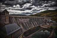 dam-stone-wall-sky-heavy-clouds-753437.jpg