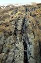 Geologic_formations_revealed_at_low_tide,_Tanjung_Rimau.jpg