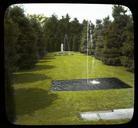 [Pirie_Garden]_[slide]:_grassy_conifer-surrounded_&quot;room&quot;_with_water_jets_and_pools_and_a_pair_of_marble_Chinese_goddess_sculptures_at_the_far_end.jpg