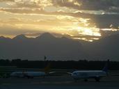 airport-aircraft-sunset-sun-clouds-79968.jpg