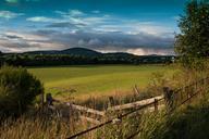 Fence_by_Grassland_and_Hills.jpg