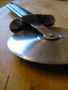 pizza-cutter-cutting-slicing-pizza-57171.jpg