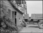 Woodland,_California._Oldest_son_of_this_family_of_Japanese_ancestry_helps_load_the_truck_for_evacu_._._._-_NARA_-_537765.jpg