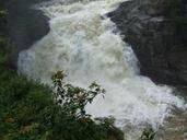 Waterfall with rocks and some trees.jpg