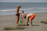 Male female and kid on beach.jpg