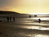 silhouettes-beach-dusk-sand-shore-268673.jpg