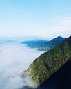 mountain-range-clouds-above-fog-801750.jpg