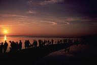 Silhouettes of people along the coast watching the sunset.jpg