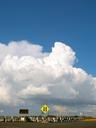 clouds-street-sign-arrows-road-395543.jpg