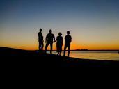 people-silhouettes-sunset-lake-527647.jpg