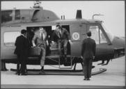 President_Nixon_and_unidentified_aide_disembarking_from_a_helicopter_-_NARA_-_194573.tif