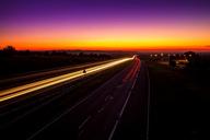 Highway_Sunset,_light_trails,_Poland.jpg