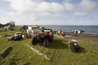 People working on camp near coast.jpg