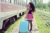 girl-train-station-calling-suitcase-1382022.jpg