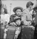 Turlock,_California._These_young_evacuees_of_Japanese_ancestry_are_awaiting_their_turn_for_baggage_._._._-_NARA_-_537656.jpg