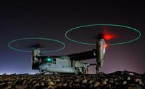 Crewmembers-walk-across-the-ships-flight-deck-before-the-sun-sets.jpg