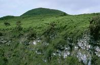 Bright green hills on Galapagos islands.jpg