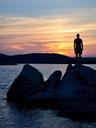 sunset-ocean-boulders-rocks-man-1086056.jpg