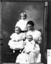 Group_portrait_of_Mrs._Young_with_children_1910.jpg