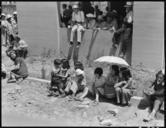 Stockton,_California._These_evacuees_of_Japanese_ancestry_are_watching_the_arrival_of_buses_bringin_._._._-_NARA_-_537727.jpg