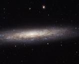 Hubble-Catches-a-Dusty-Spiral-in-Virgo.jpg